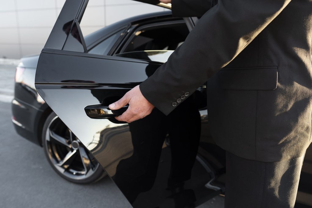 My Perfect Transfers Corfu picture of driver with opened car door at the airport
